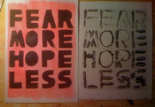 The image is a photograph of handmade print next to one of the stencils. They read "FEAR MORE HOPE LESS". 